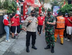 Babinsa, Bhabinkamtibmas Utan Kayu Selatan Sukseskan Lomba Gerak Jalan Santai