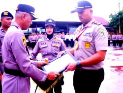 KAPOLRES PIDIE – PIMPIN UPACARA HUT SATPAM Ke 42 DILAPANGAN APEL POLRES