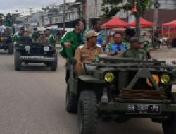 ” pesta kemenangan ” Pemain Merangin FC Bersama Nilwan Yahya di Arak di Jalan Utama Kota Bangko.