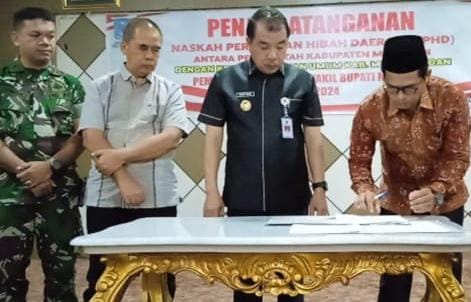 Pj Bupati Merangin Teken NPHD dengan KPU  H Mukti Kembali Tekankan Netralitas ASN