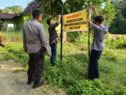 Curah Hujan Tinggi, Kapolsek Limun AKP B. Tarigan Pasang Spanduk Peringatan Himbau Masyarakat Waspada Bencana