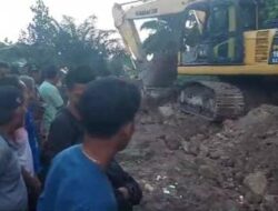 Pj Bupati Merangin Langsung Turunkan Alat Berat Perbaiki Jalan Batang Masumai yang Rusak