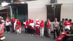 Bhabinkamtibmas Kelurahan Tengah Amankan Jalan Sehat HUT Ke- 80 RI